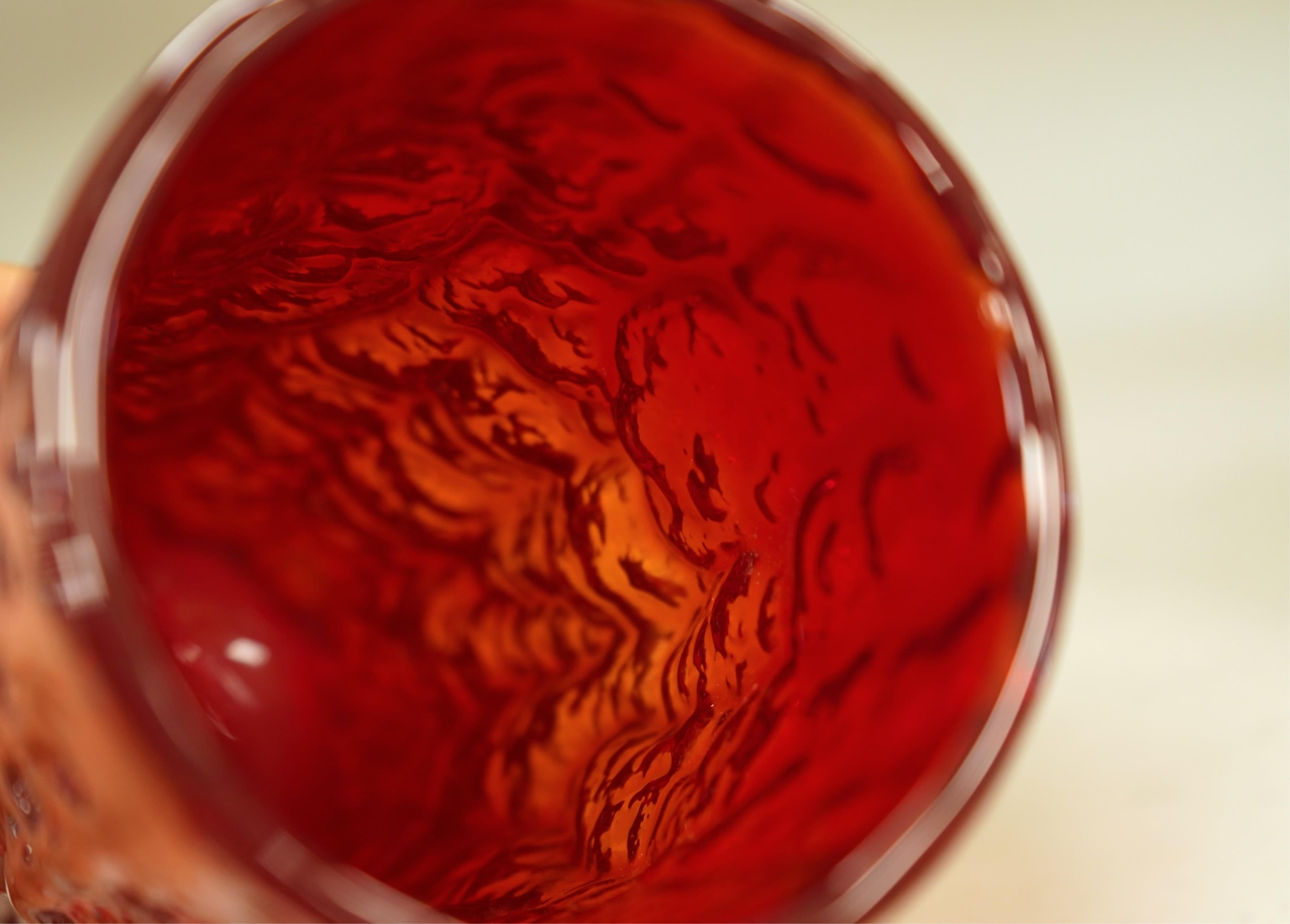 A Geoffrey Baxter for Whitefriars ruby red bark vase, 19cm high